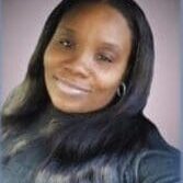 Portrait of a woman with long black hair and a gentle smile.